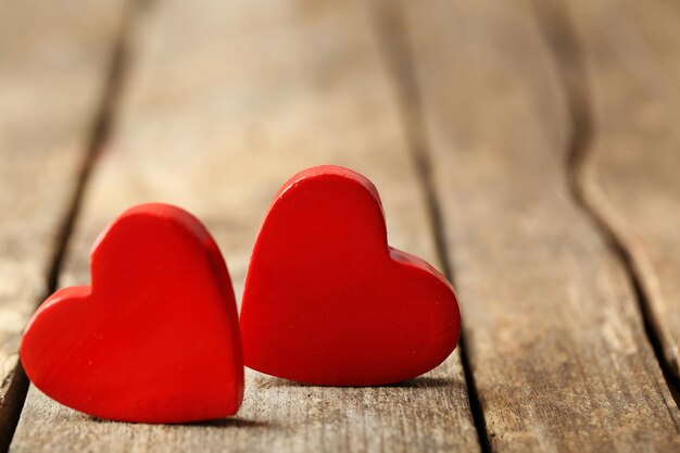 Wooden hearts on rustic wooden background