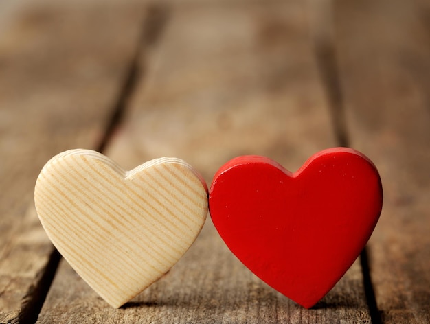 Wooden hearts on rustic wooden background