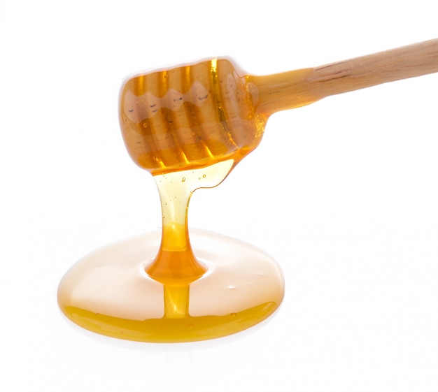 wooden honey dipper with honey
