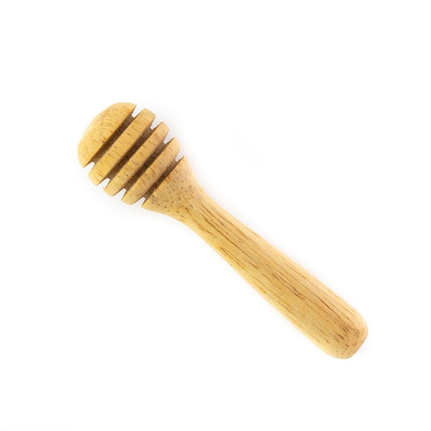 Wooden honey stick isolated on white background