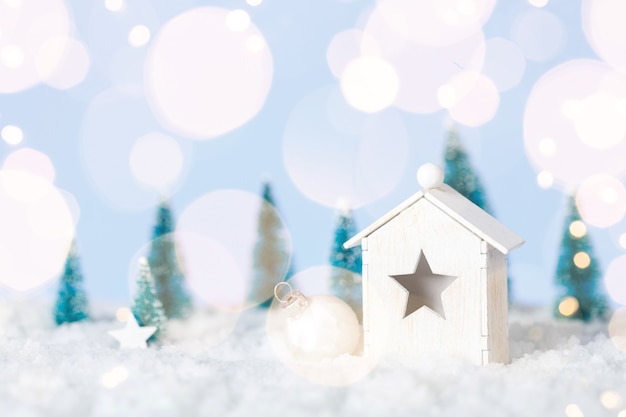 Photo wooden house christmas with decirations on white snow background