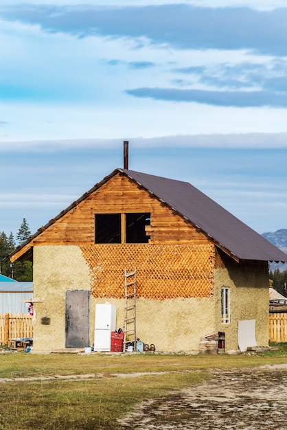 Wooden house under construction in village of KyzylTash KoshAgach district Altai Russia