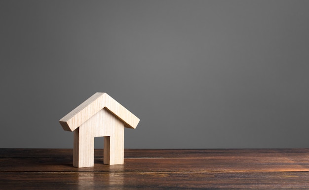 Wooden house figure. Modern architecture. Mortgage.