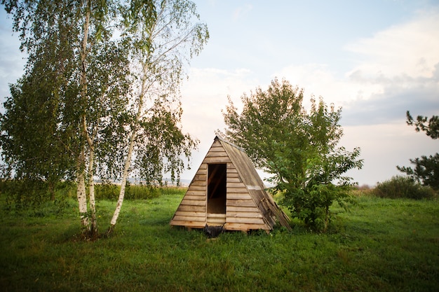 Wooden house in the form of a triangle