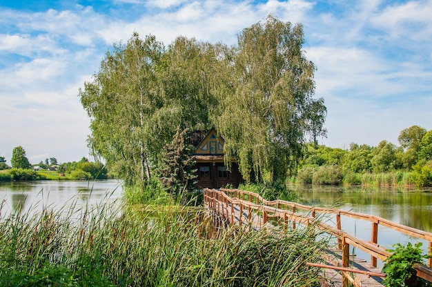 Wooden house on the island in the middle of the lake