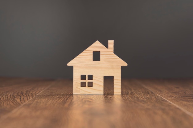 Wooden house model on table