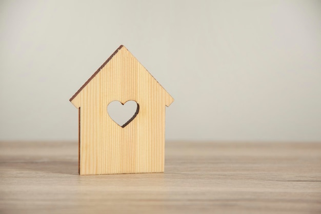 Wooden house model with heart window