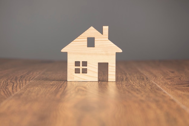 Wooden house models on table