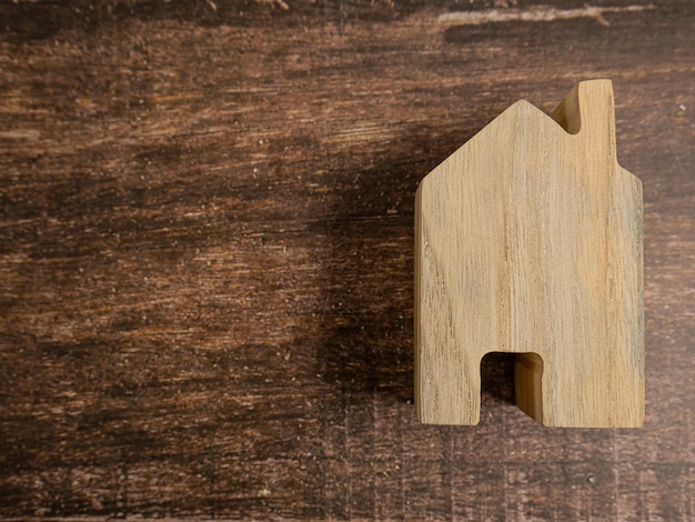 Wooden house on table for property or construction concept