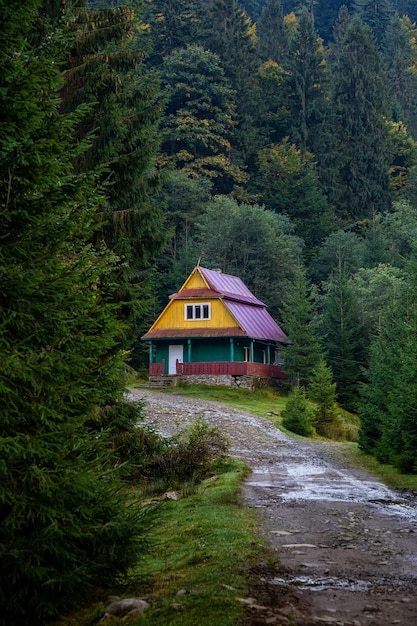 Wooden house for tourists in the autumn Carpathian forest