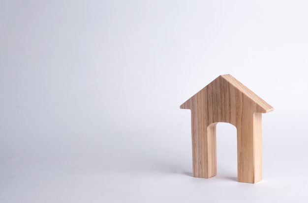 Wooden house with a large doorway on a white background