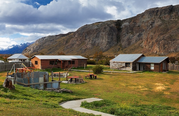wooden houses on the background of mountains. El Chalten. Patagonia, South America