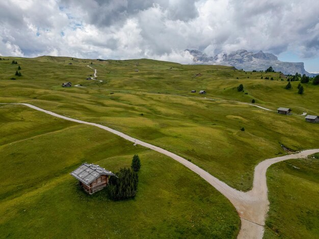 Wooden hut on An Aerial view of Armentarola fields Dolomites Alps near Alta Badia TrentinoAltoAdige region Italy Summer season