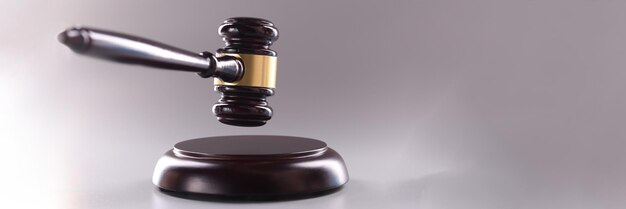 Wooden judge gavel on a gray background