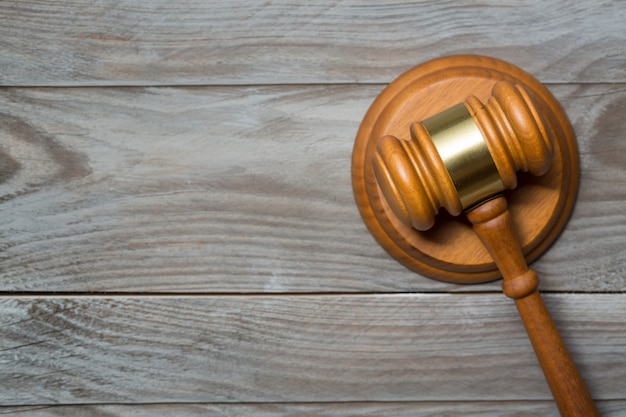 Wooden judge gavel hammer on wooden table background.