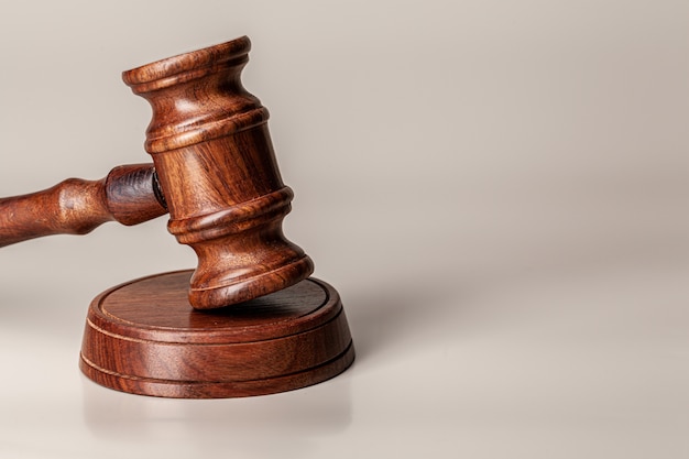 Wooden judges gavel on table close up