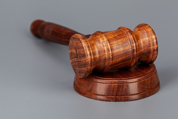 Wooden judges gavel on table close up