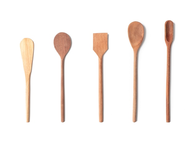 Wooden kitchen utensils isolated over white background.