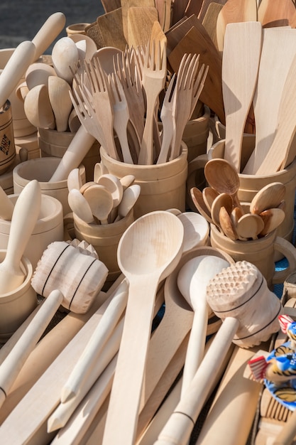 Wooden kitchen utensils on table. Closeup