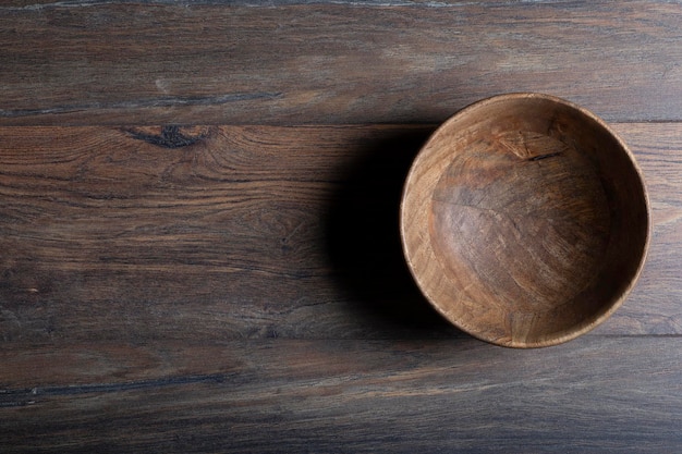 Wooden laminate parquet floor with texture and bamboo wooden empty bowl