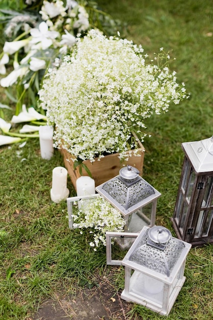 Wooden lantern and white flowers gypsophila