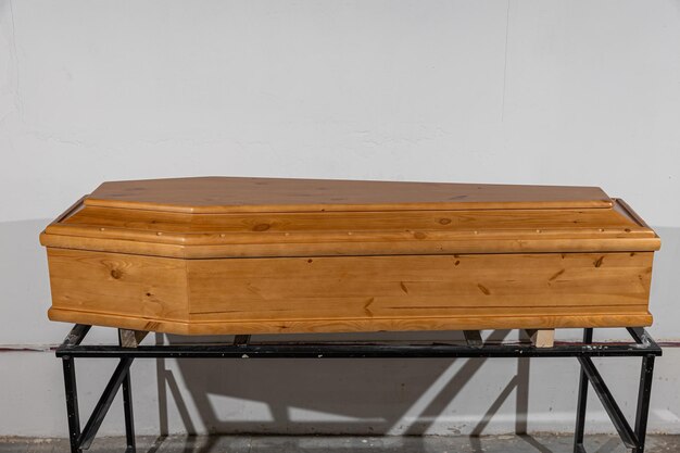 Wooden laquered coffin for sale in a special ritual store