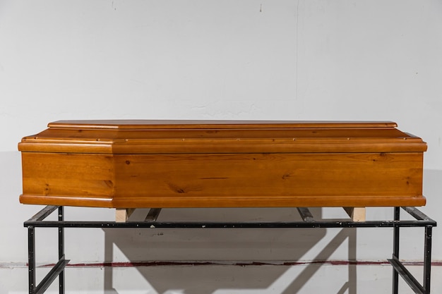 Wooden laquered coffin for sale in a special ritual store