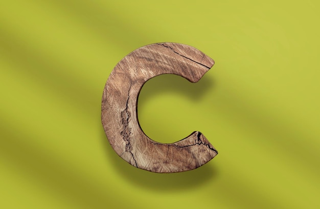 A wooden letter c PSD with a green background