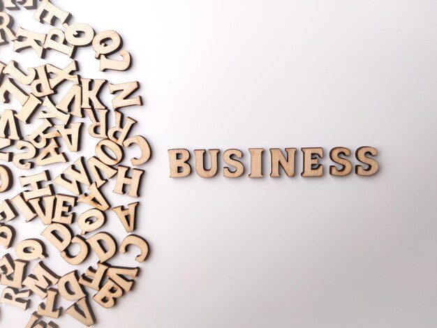 Wooden letter toy arranged the word BUSINESS