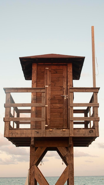 Wooden lifeguard post on a lonely beach in the Mediterranean sea