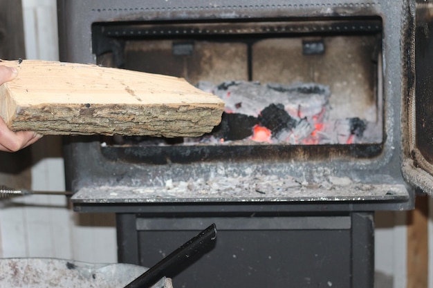 Wooden log on barbecue grill