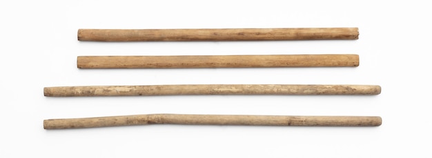 Photo wooden long stick set isolated on white background