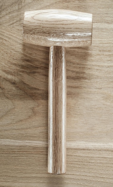 Wooden mallet on wood board