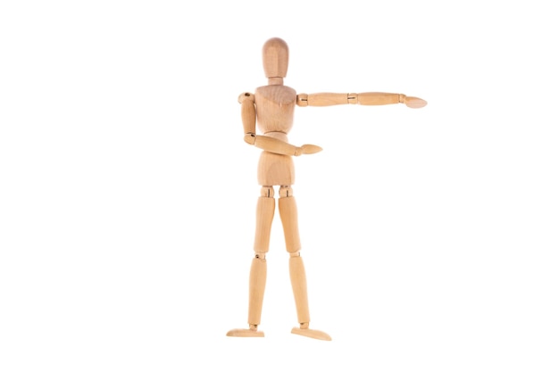 Photo wooden man pointing with his hand to the side isolated on white background