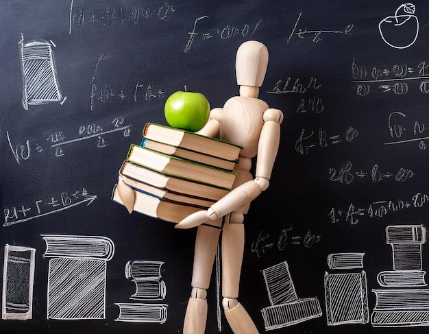 wooden mannequin carrying books