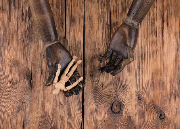 wooden mannequin in the hands of a mannequin