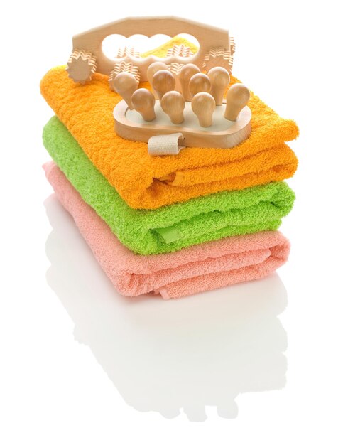 Wooden massagers on towels