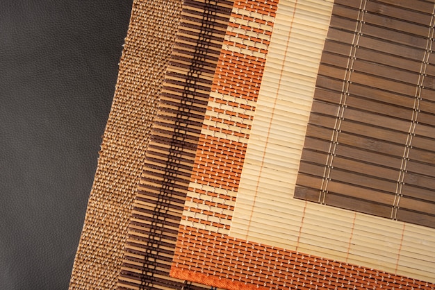 Wooden mat, all the details, textures and colors of a wooden mat, top view.