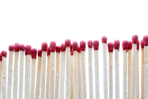 Wooden matches with red heads on a white background