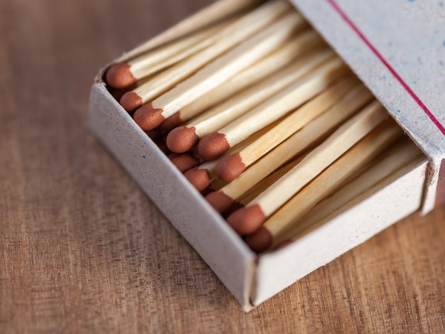 Wooden matches on a wooden table.