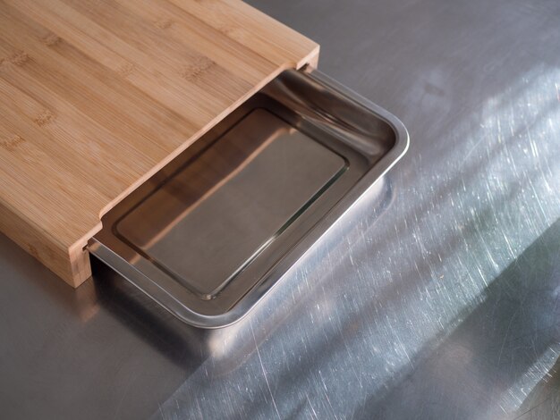 Wooden and metal plate in the kitchen