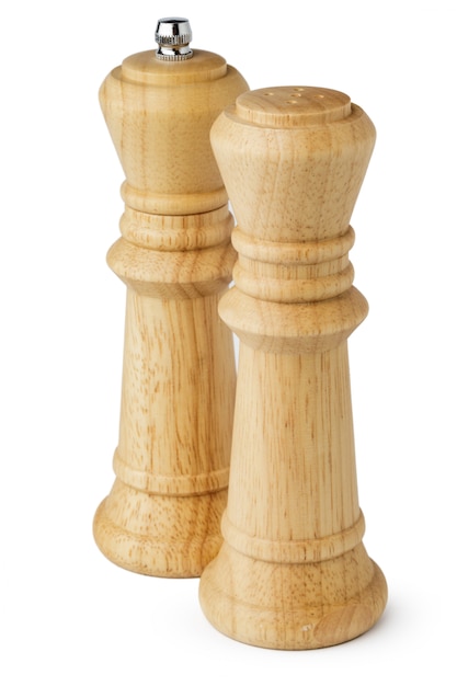 Wooden mills with salt and pepper on white