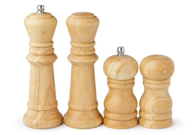 Wooden mills with salt and pepper on white