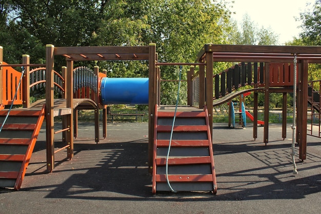 Wooden modern ecological safety children outdoor playground equipment in public park. Nature archite