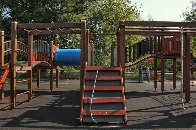 Wooden modern ecological safety children outdoor playground equipment in public park. Nature archite