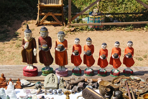 Wooden monks with alms wood carving from wood at Mondalay Myanmar