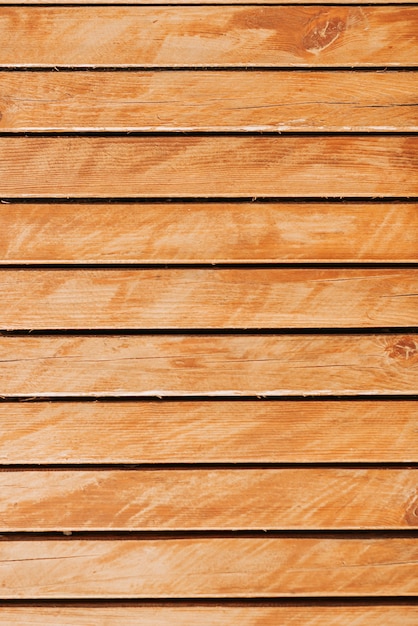 Wooden narrow planks background close up