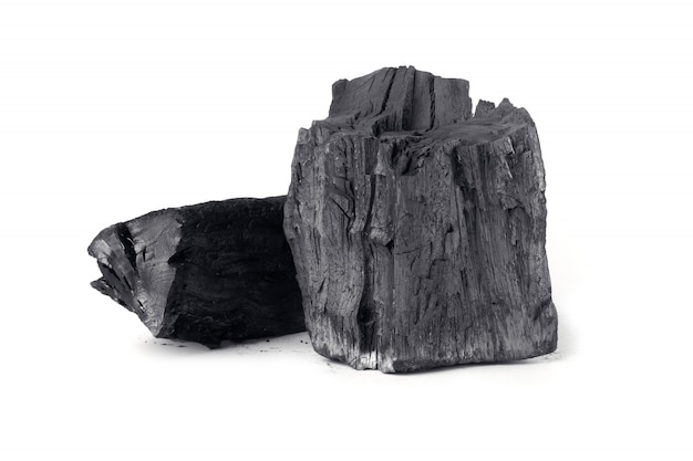 Wooden natural charcoal isolated on white surface