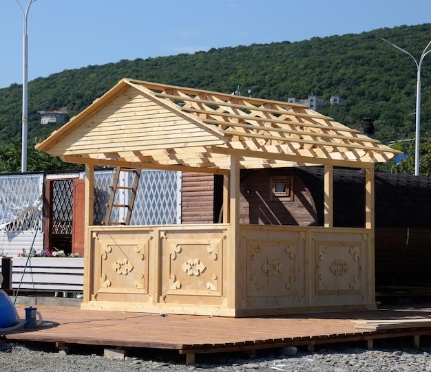 Photo wooden new gazebo sunshade shelter beach of the sea