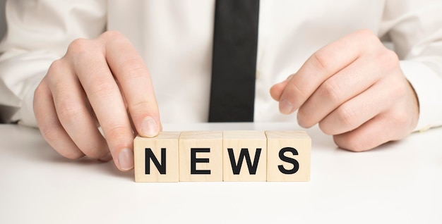 Wooden news sign on a table in an office